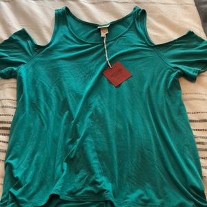 Shirt with cut out shoulder
